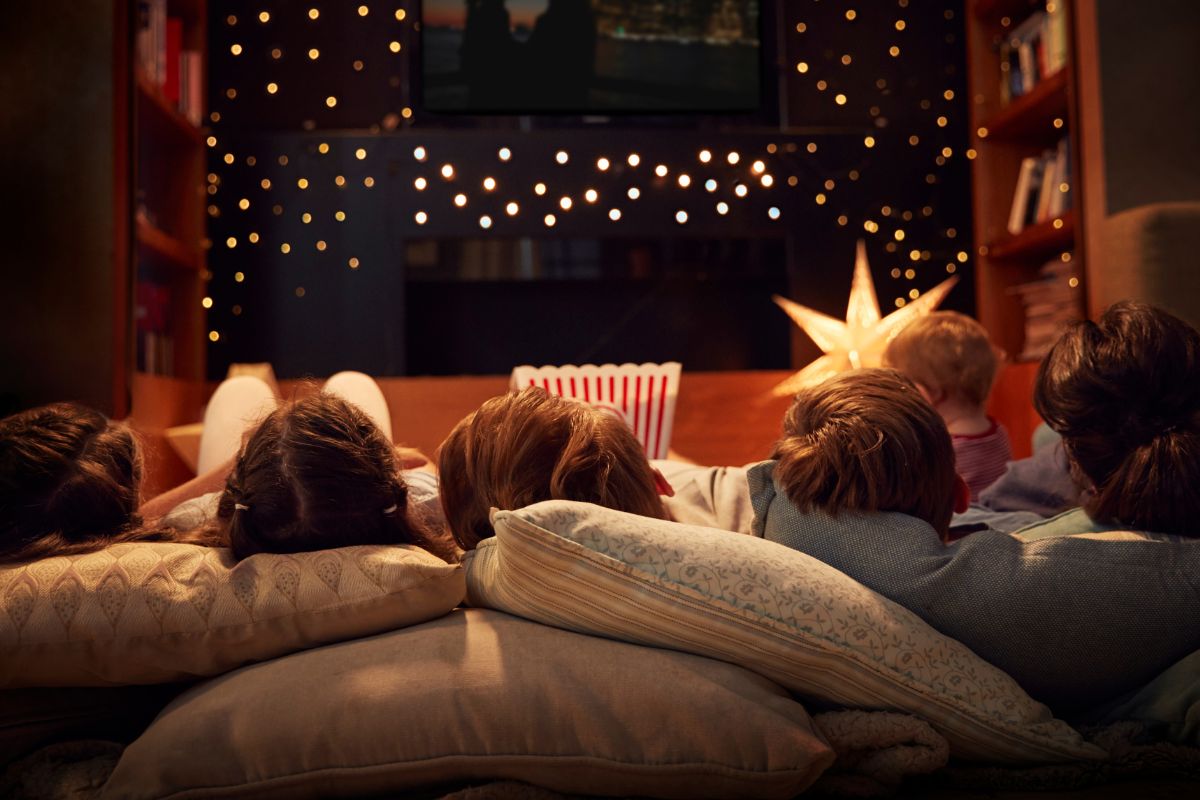 A group of family watching a movie marathon.