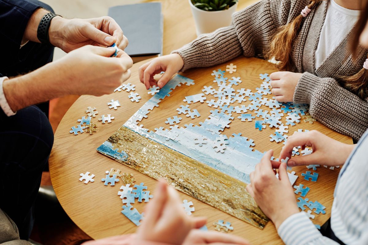 Group of people playing puzzle games.