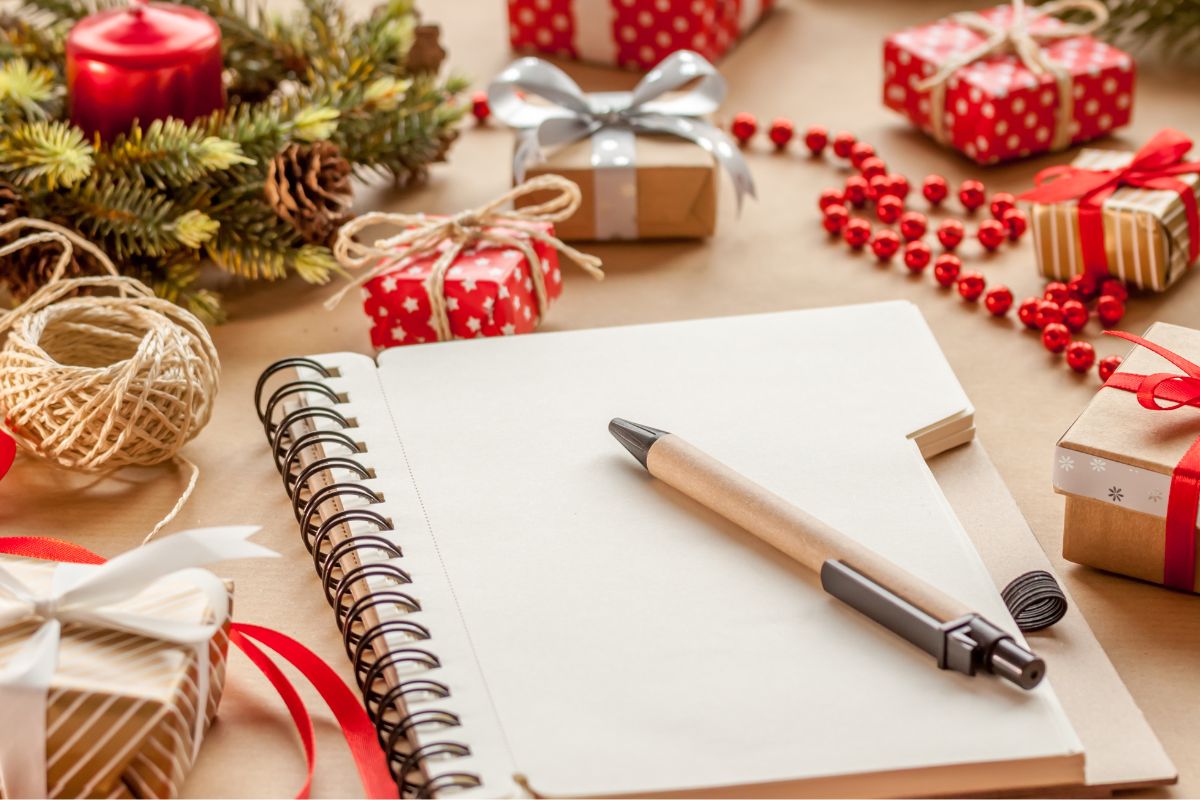 Photo of decorations, a notebook, and a pen.