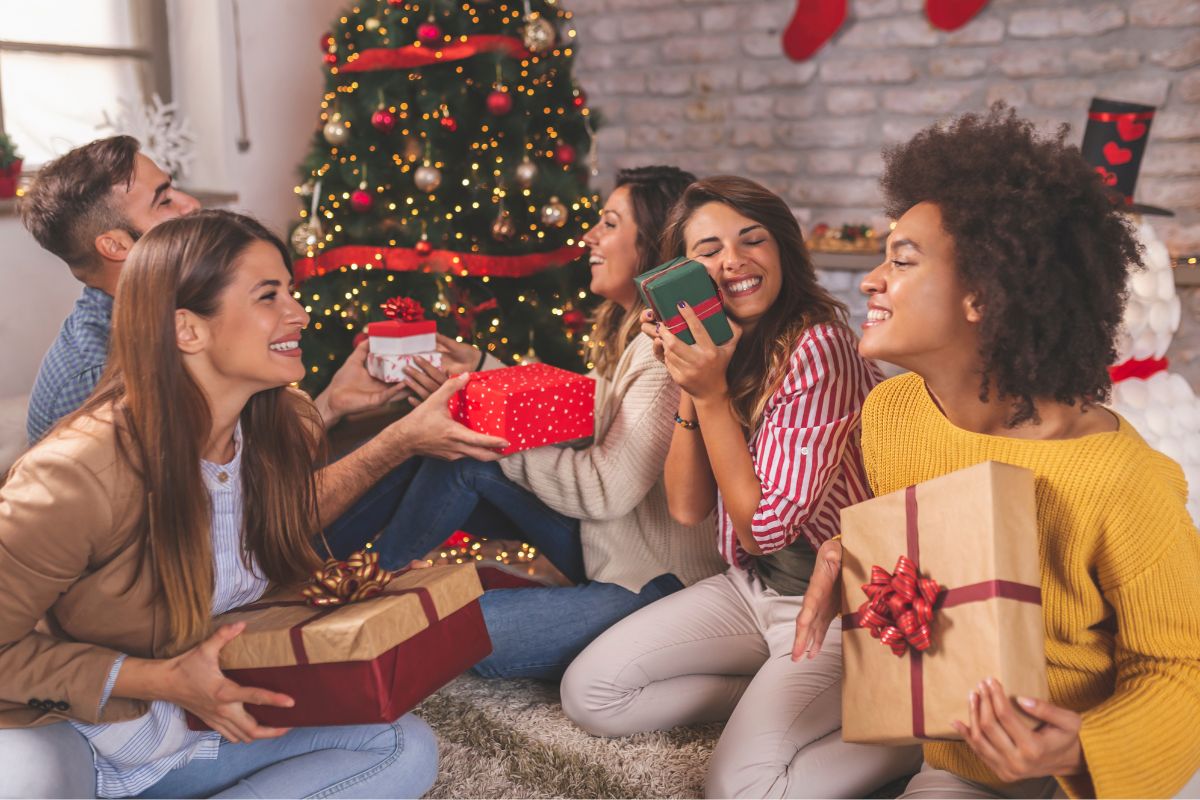 Picture of a group of friends exchanging gifts.
