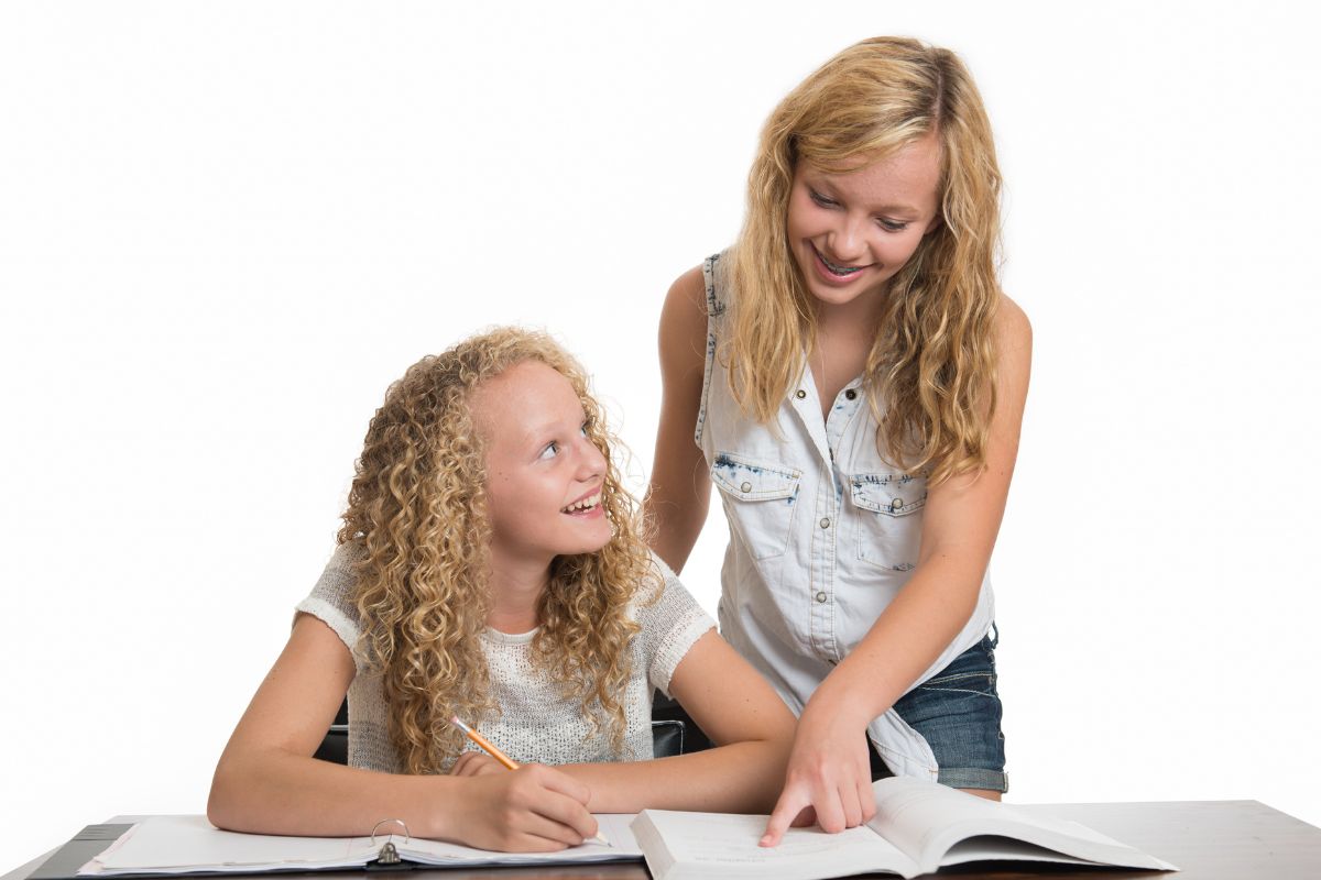 A young lady tutoring her student.