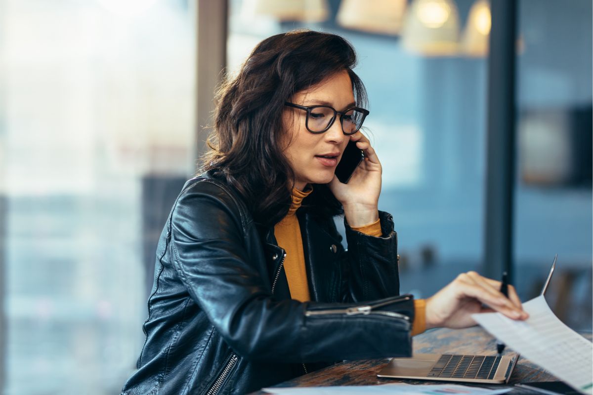 A woman having a phone call while working.