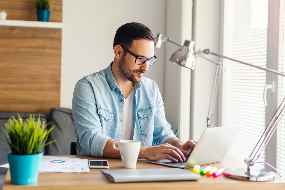 Image of a man working from home.