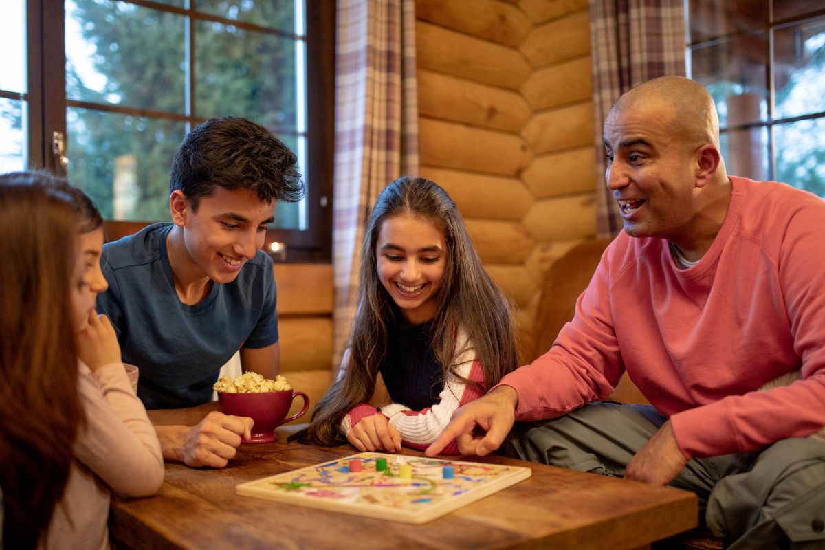 A group of family playing board games together.