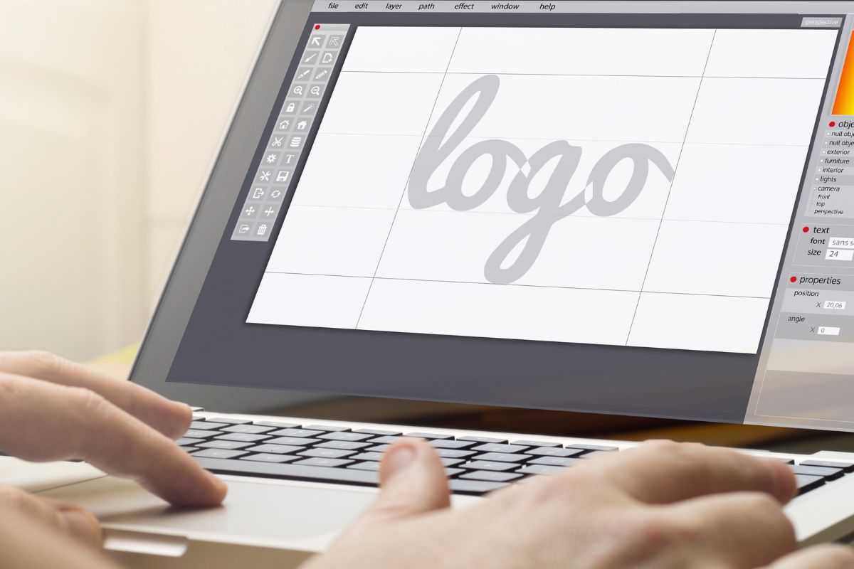 A man's hand making a logo.