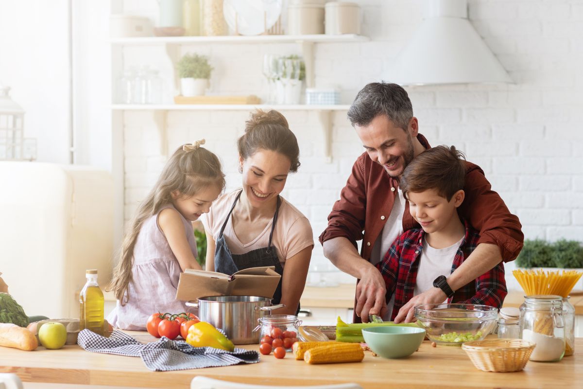 Image of a family cooking a meal together.