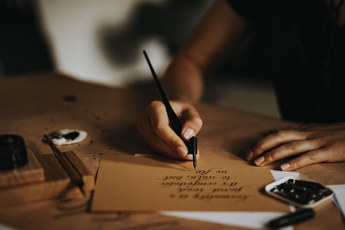 Image of a woman writing a letter.