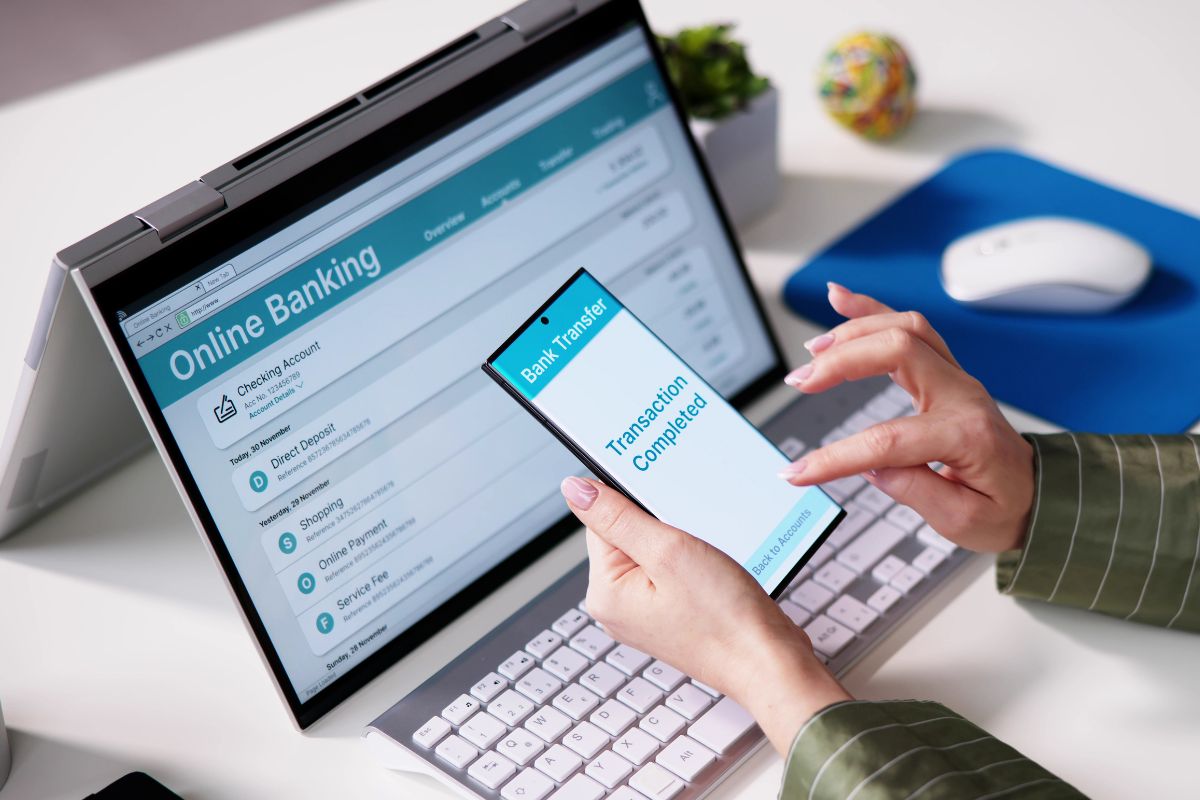 Picture of a woman's hand paying online.