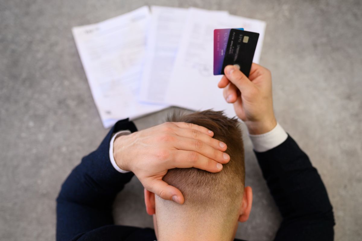 Photo of a man with credit card debt.