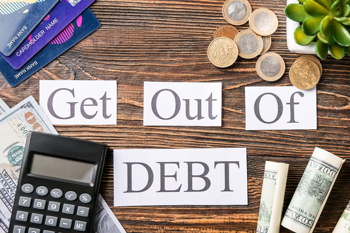 Image of a get out of debt wording and money.