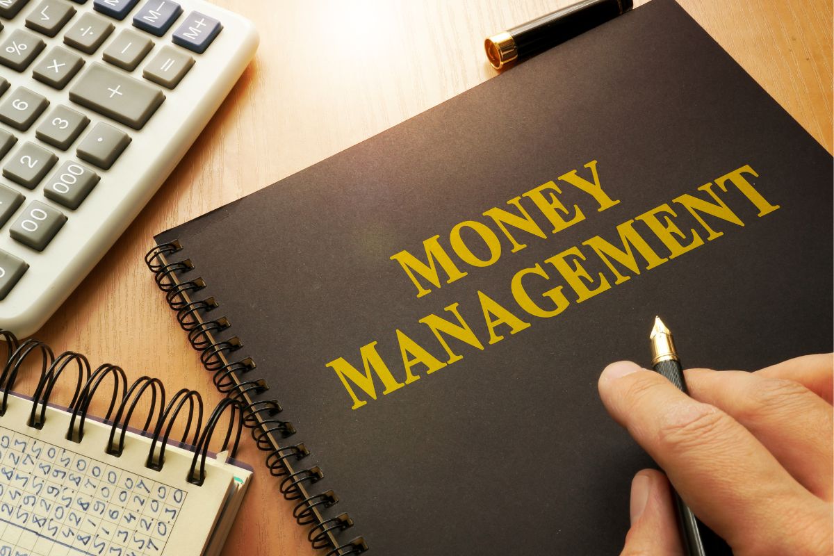 A man's hand learning money management.