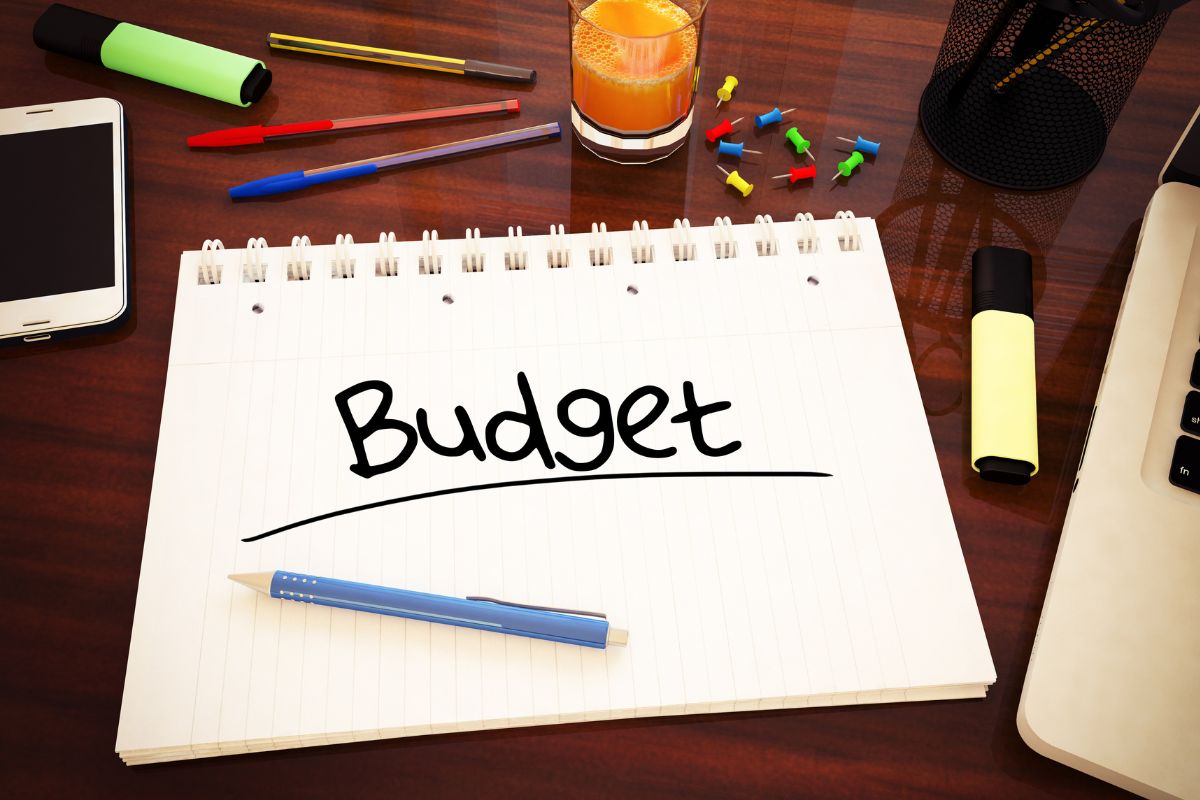Image of a notebook with budget wording.