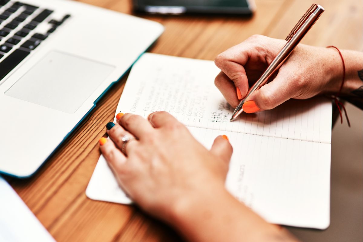Image of a woman tracking her expenses.