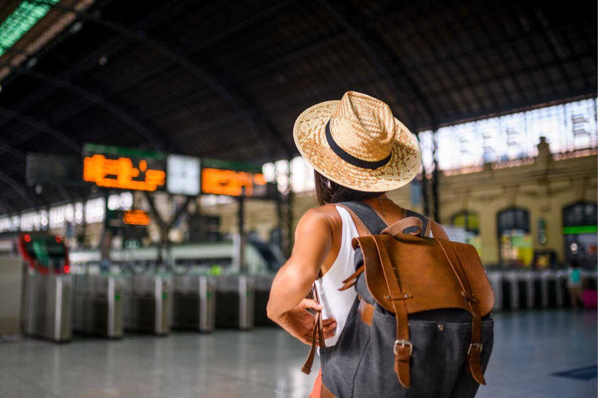 The picture of the girl arriving at the airport with her bag which means to limit travel and use budget-friendly accommodation helps free up money for savings or other priorities. 