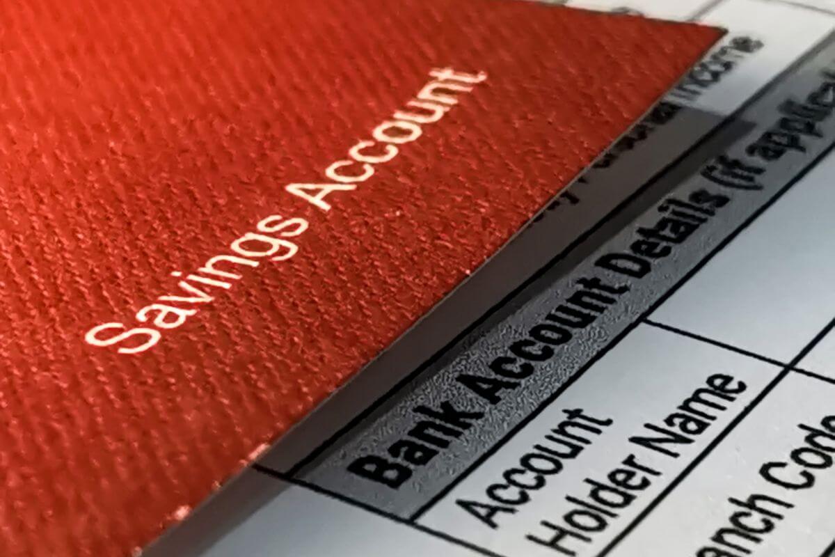 The picture tells about a bankbook with notes and a piece of paper with notes indicating that opening a high-yield savings account helps your money grow faster while staying accessible.