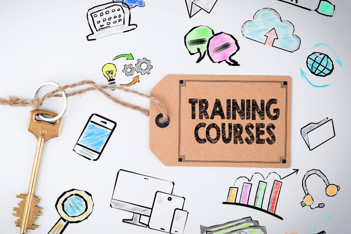 The photo tells about the icon drawings on the paper a tag with notes and a key which refers to investing in courses that can lead to better job opportunities and higher income.