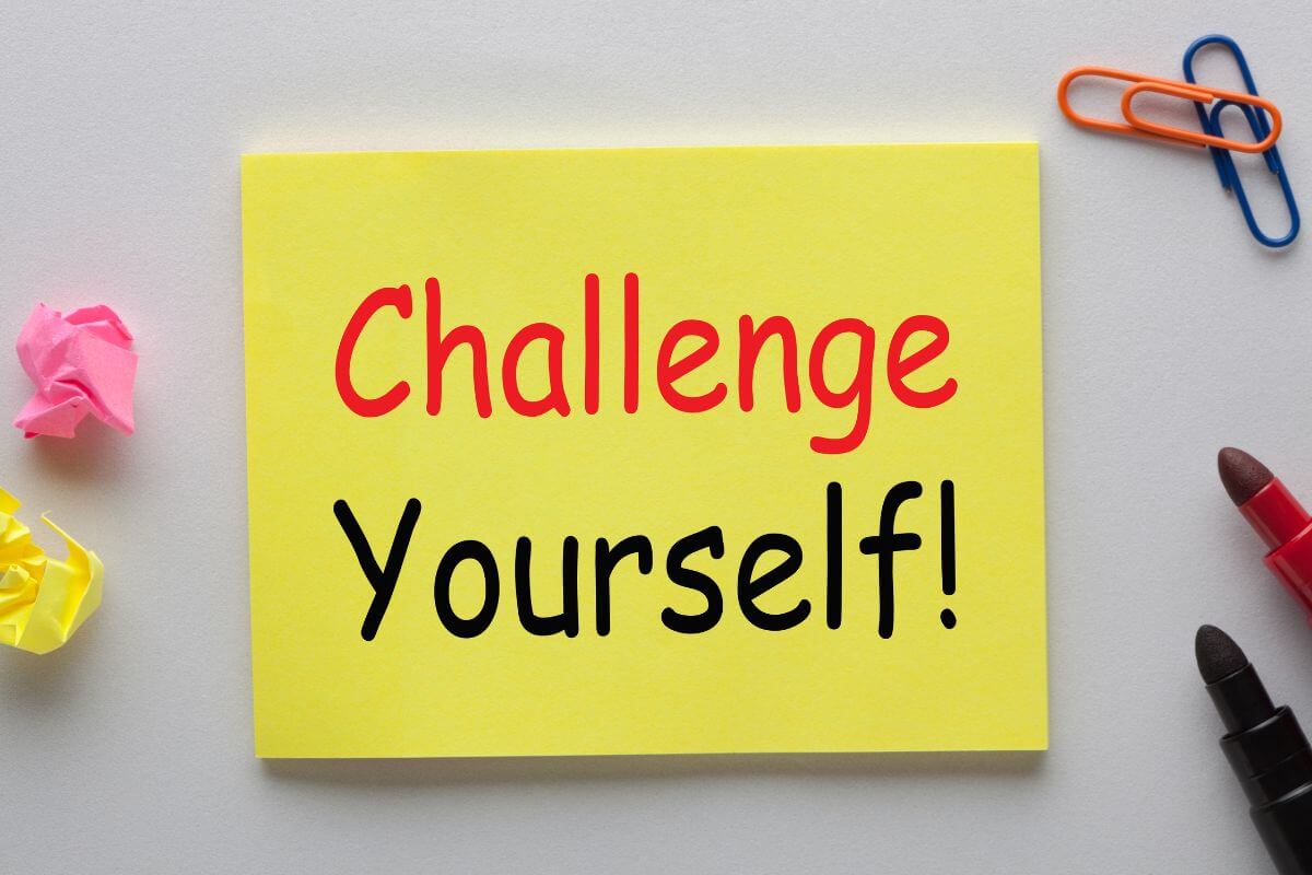 The image of crumpled papers, pins, markers, and a piece of yellow paper with notes indicates to challenge yourself to match all non-essential purchases to stay disciplined while still enjoying life.