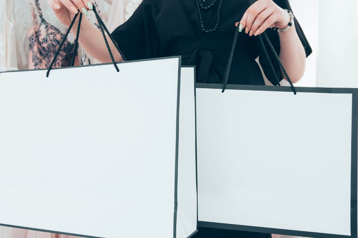 The picture shows a girl buying expensive items at the store indicating that lifestyle inflation can trap you.