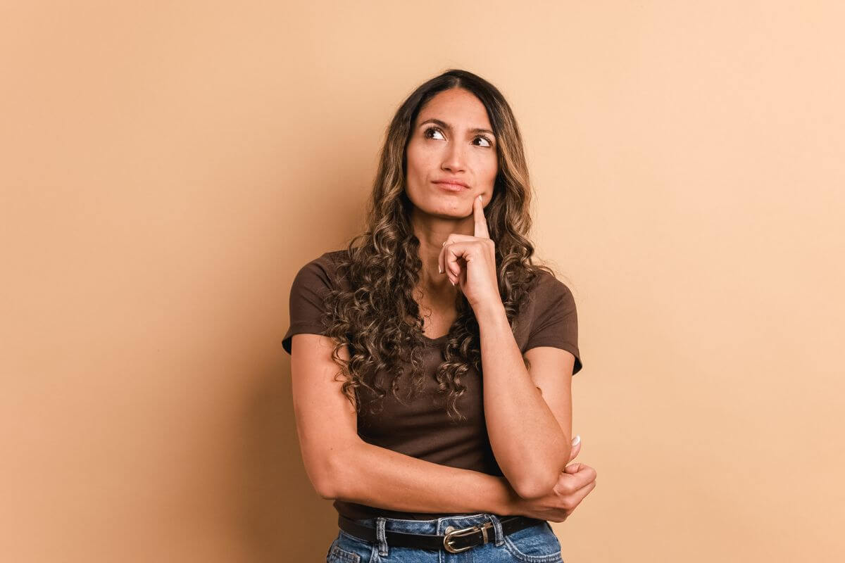 The picture shows a girl thinking, suggesting that you try the 30-day rule by giving yourself time to decide if you really need something.