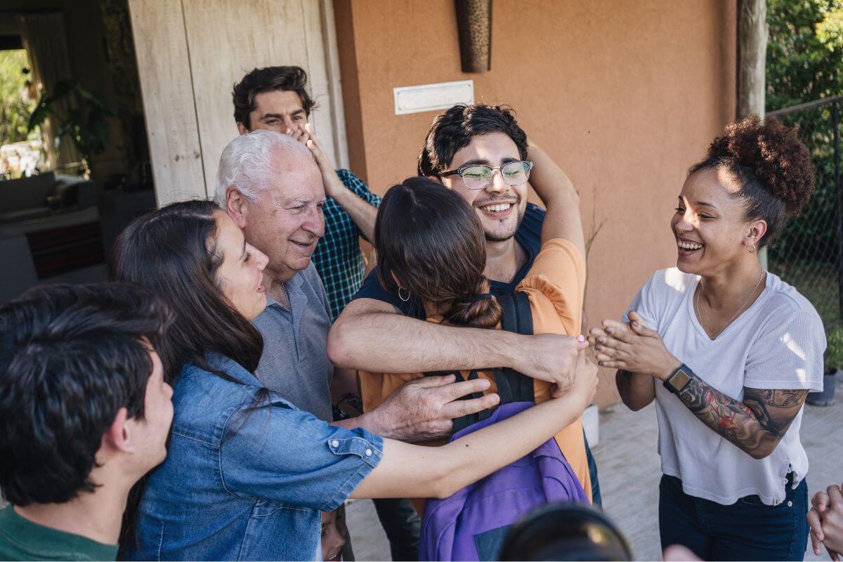 The photo shows a group of family happy to see their one member referring to borrowing money which risks favoritism or inequality among family of friends that can lead to feelings of unfair treatment.
