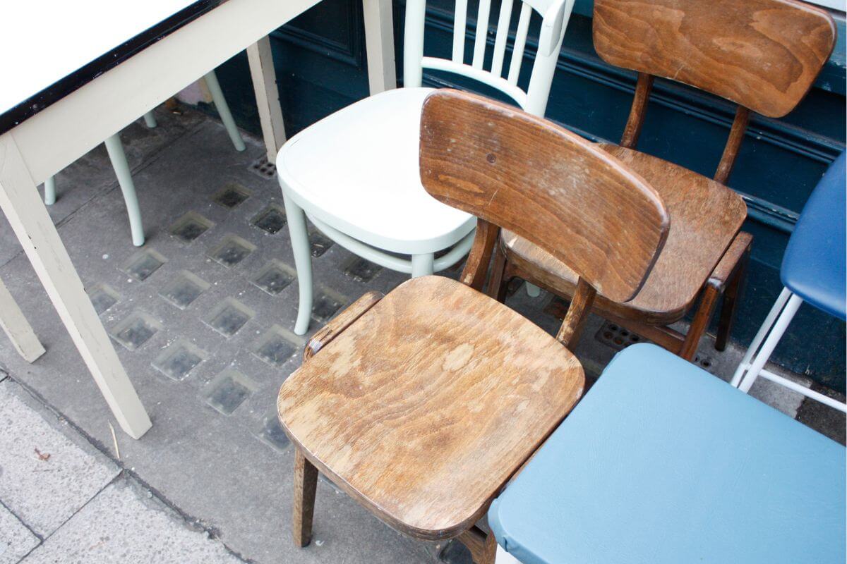 The image of chairs and tables to flip furniture by refurbishing and reselling to make extra money.