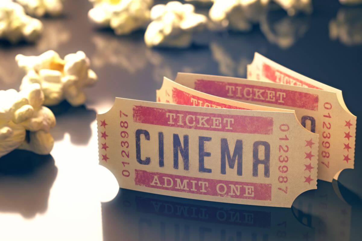 The photo shows popcorns and tags notes and stamp which refers to taking advantage of reduces movie ticket prices for seniors and keep costs low while still offering a night of fun.