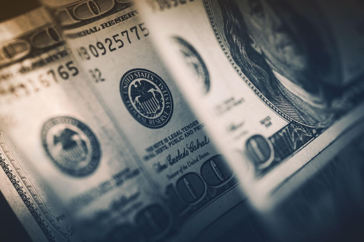 The picture tells about dollar bills indicating to invest your money to get compounding makes your money earn more over time. 