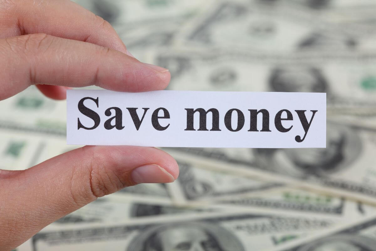 The photo shows dollar bills from behind and a girl's hand holding a piece of paper with notes indicating to find your money-saving challenge and reach your financial goals.