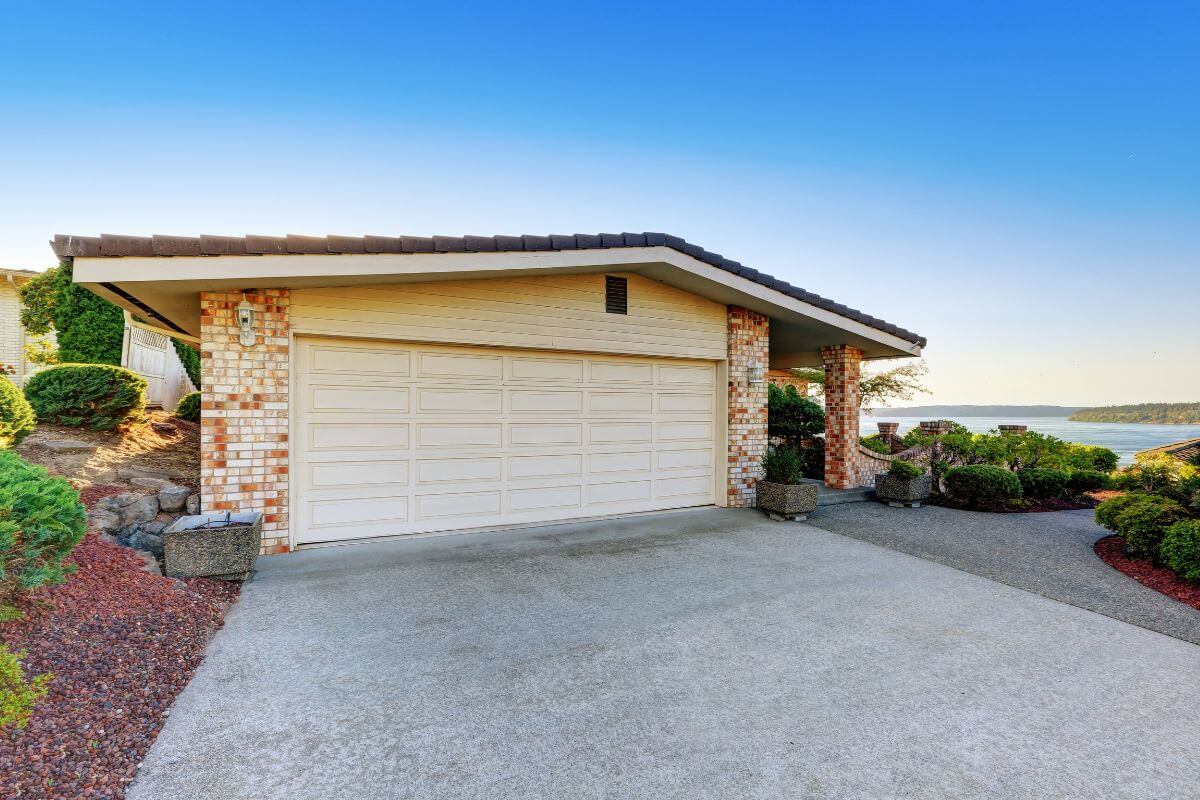 The photo shows a house with a garage indicating to rent out your driveway space to turn an empty space into money.
