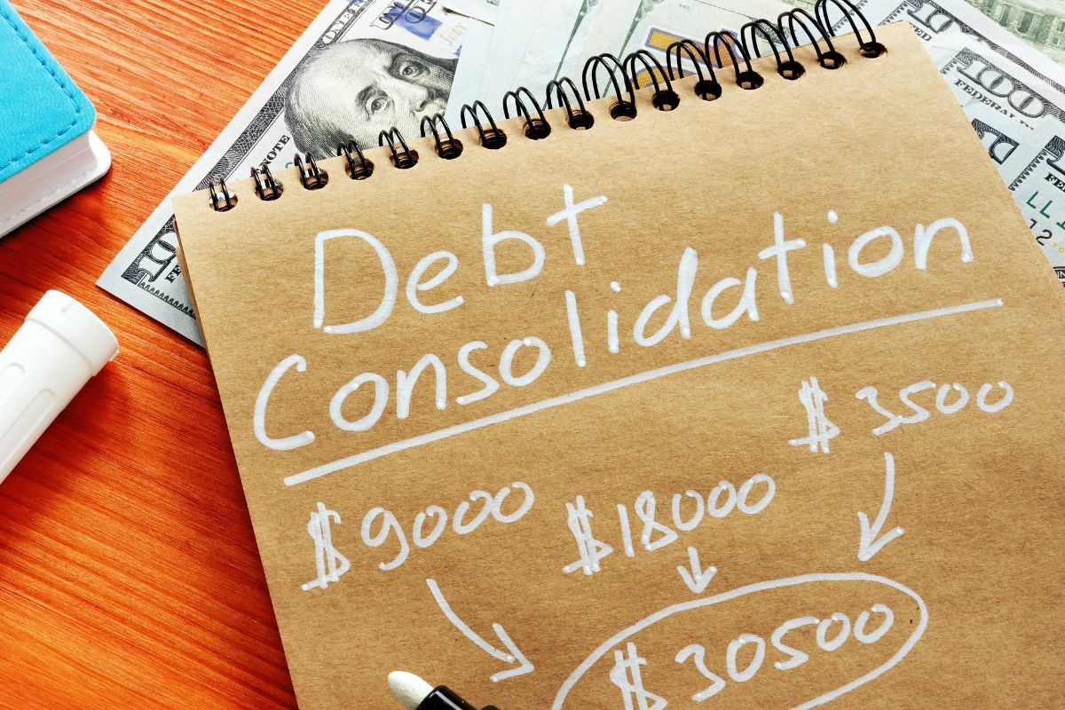 A notebook with debt consolidation wording.