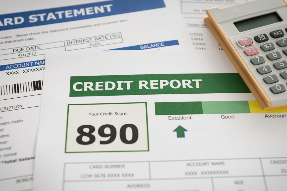 The photo shows papers with credit reports.