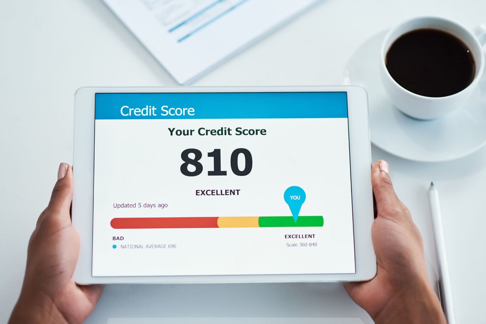 A woman's hand checking her credit score.