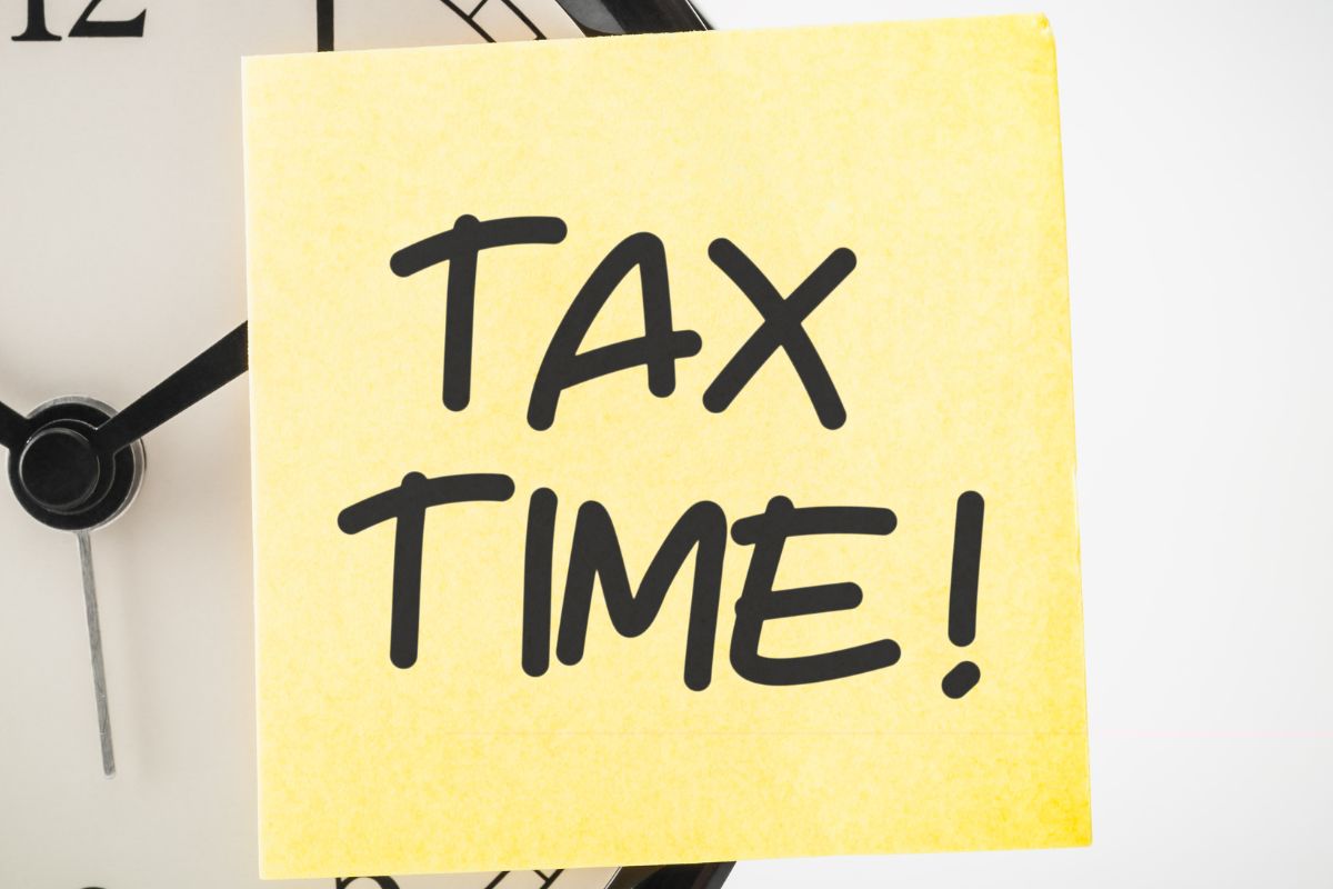 Photo of a paper with tax time written on it.