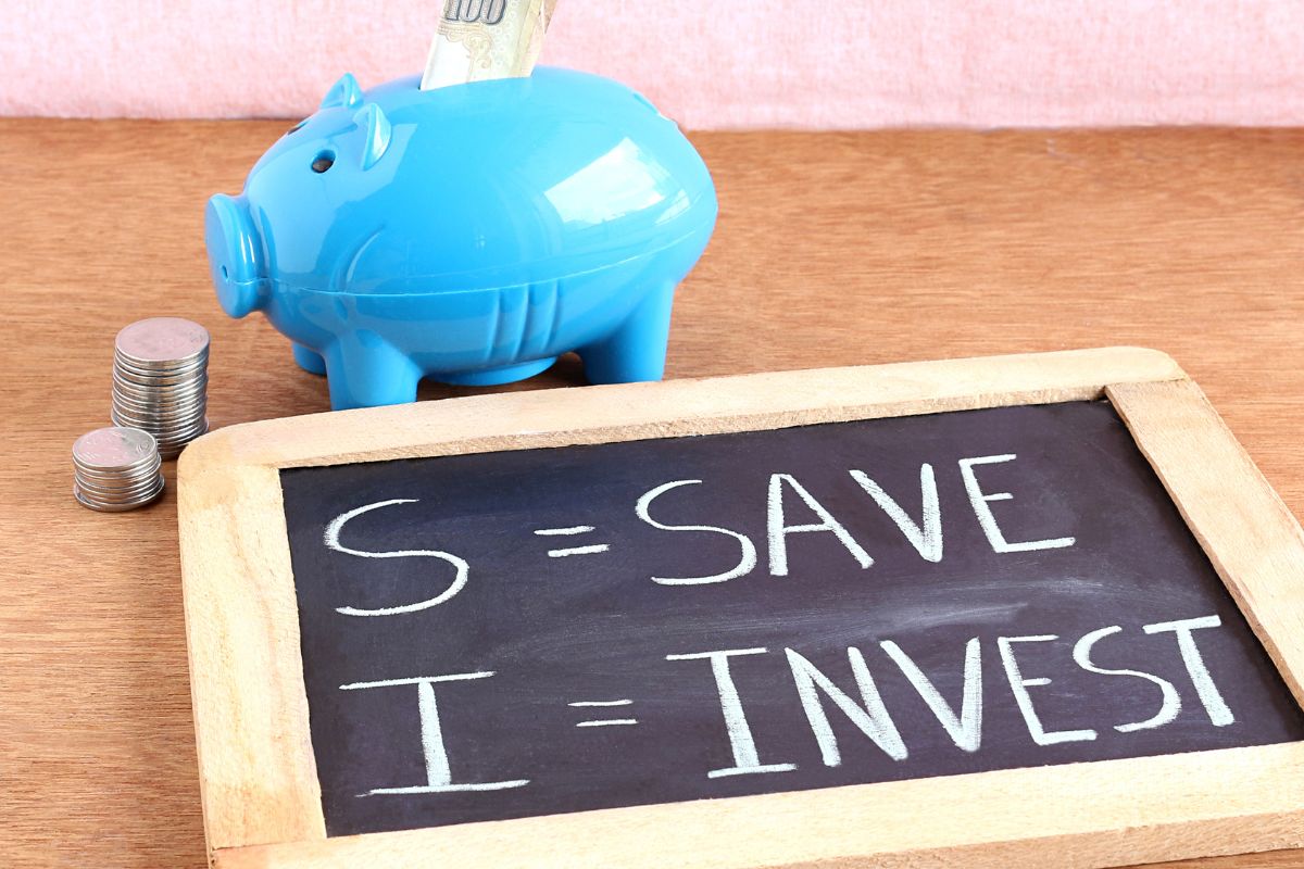 Image of a board with save and invest wording.