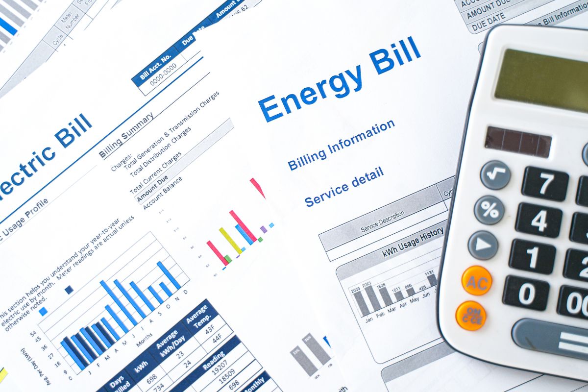 Image of bill invoices and a calculator.