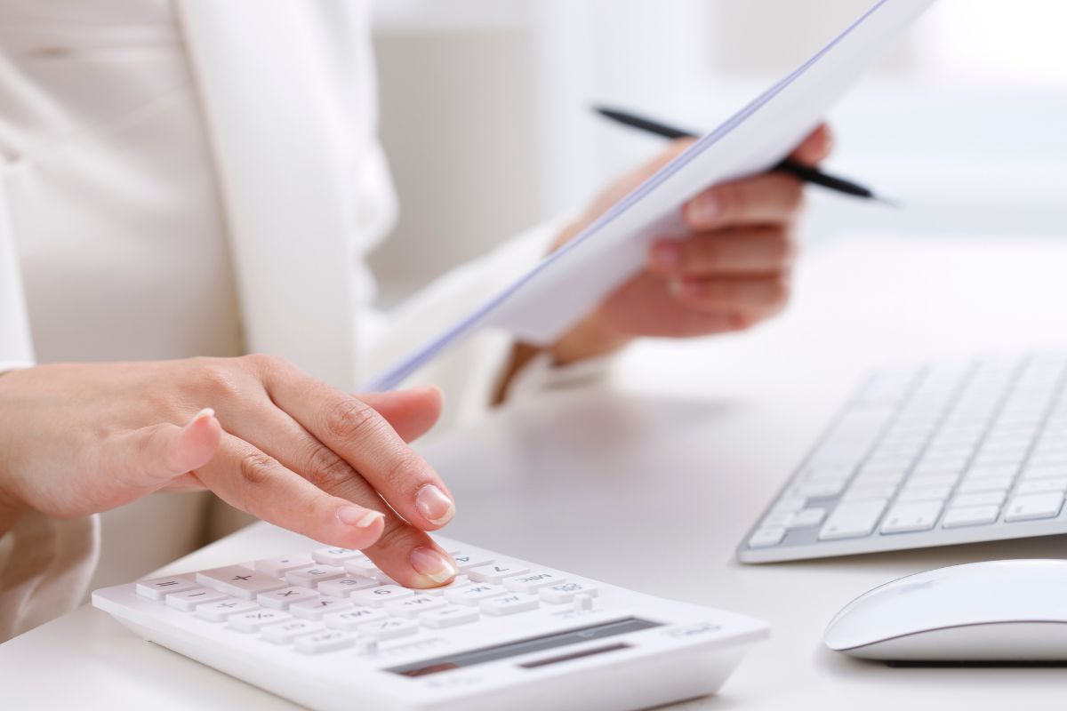 Image of a woman's hand budgeting.