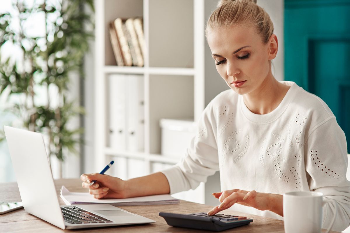 Picture of a woman analyzing her spending.