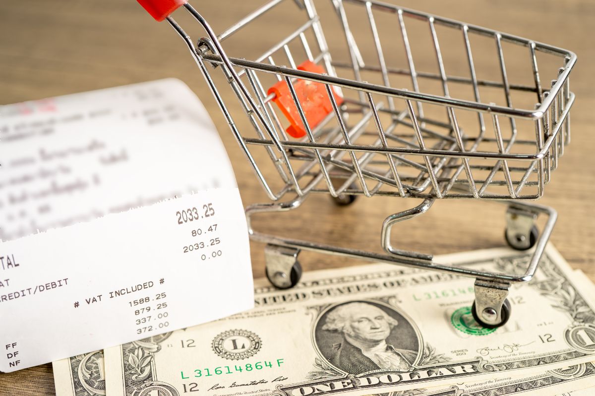 Photo of money and cart.