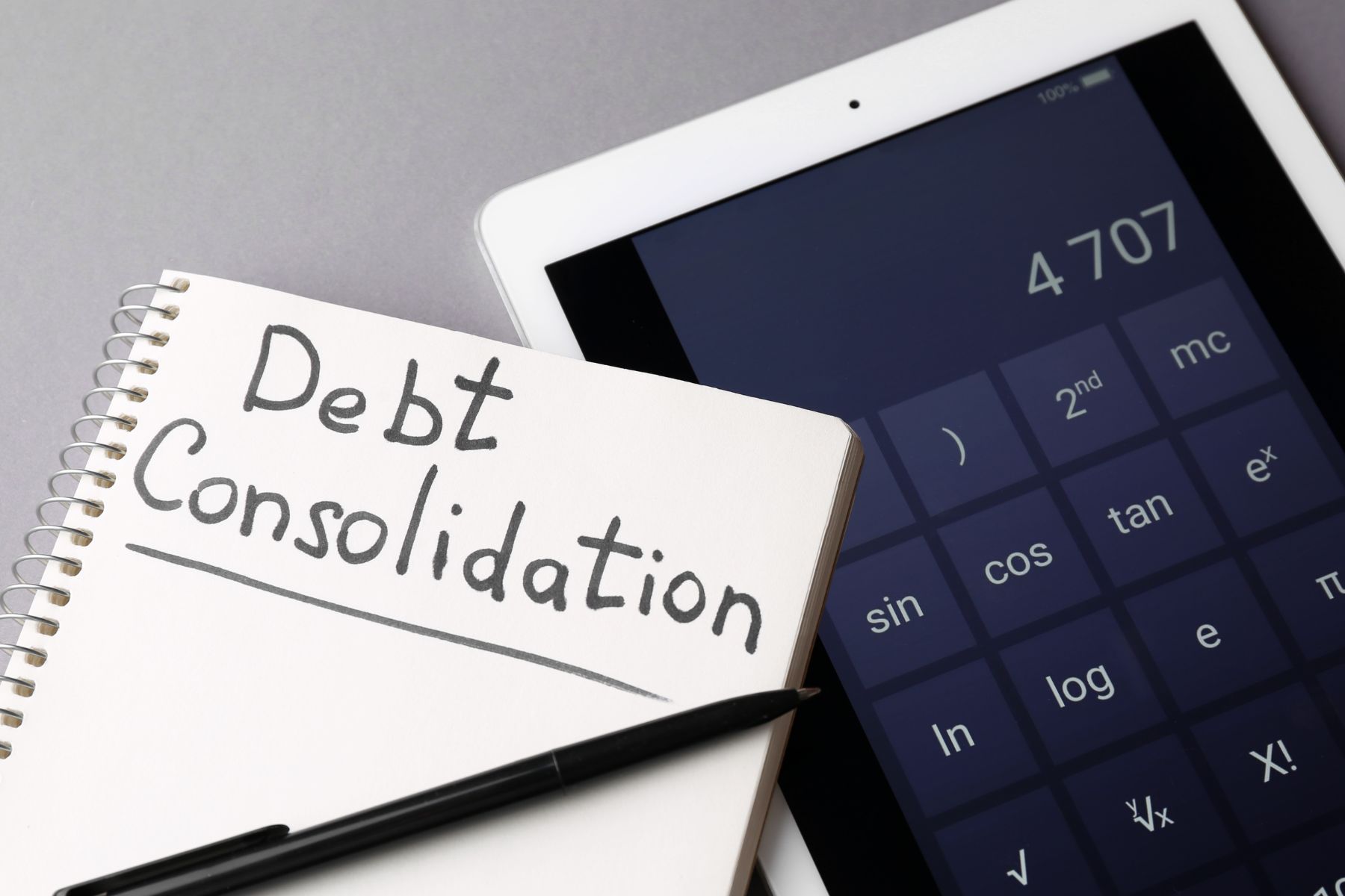A notebook with debt consolidation wording.