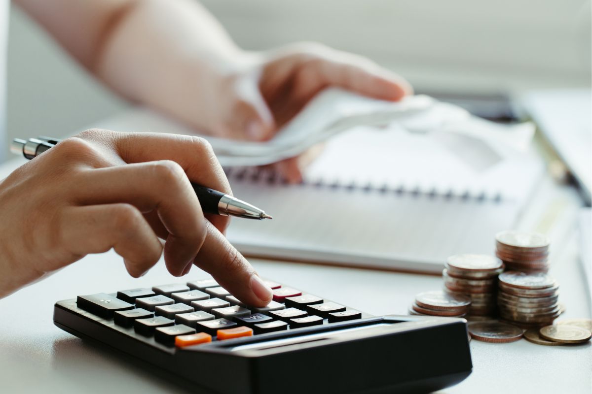 The picture shows a woman budgeting.