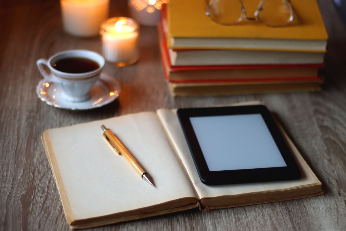 The photo shows a notebook and a tablet device.