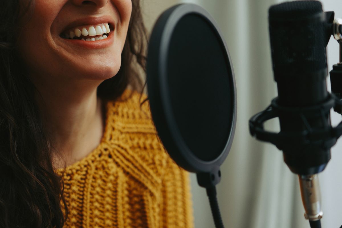 Picture of a woman doing a voiceover.