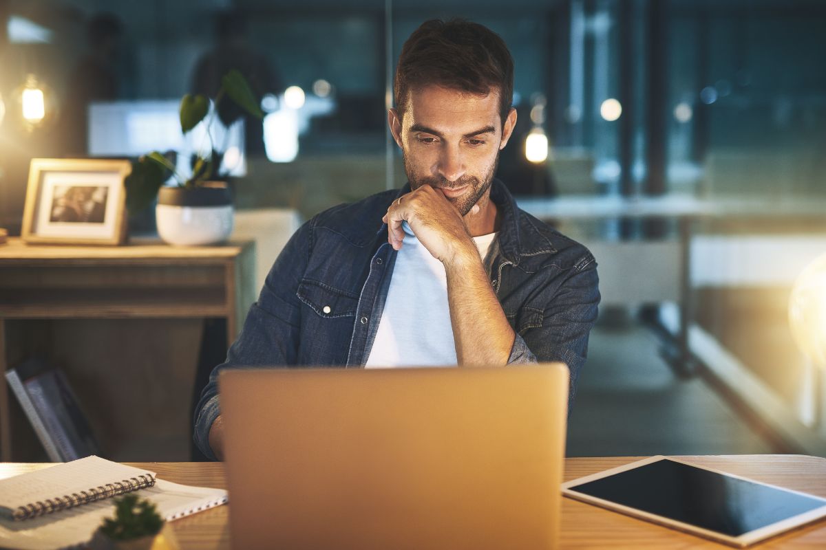Picture of a man using a laptop.