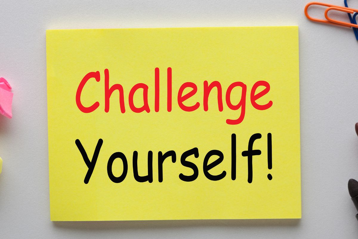 The photo shows a paper with challenge yourself wording.