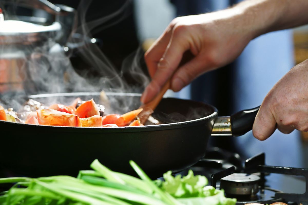 A man cooking meals at home.