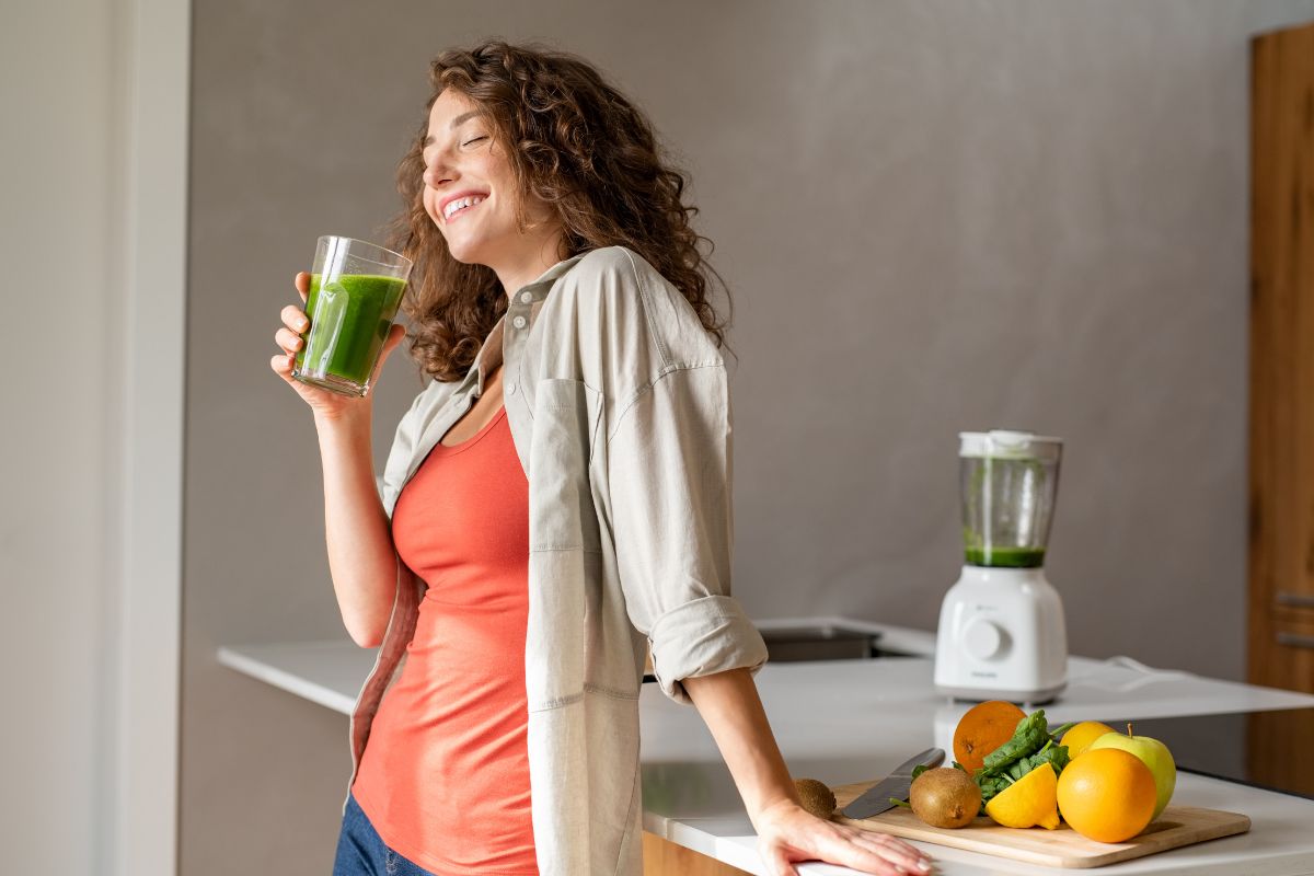 Photo of a woman drinking healthy juice.