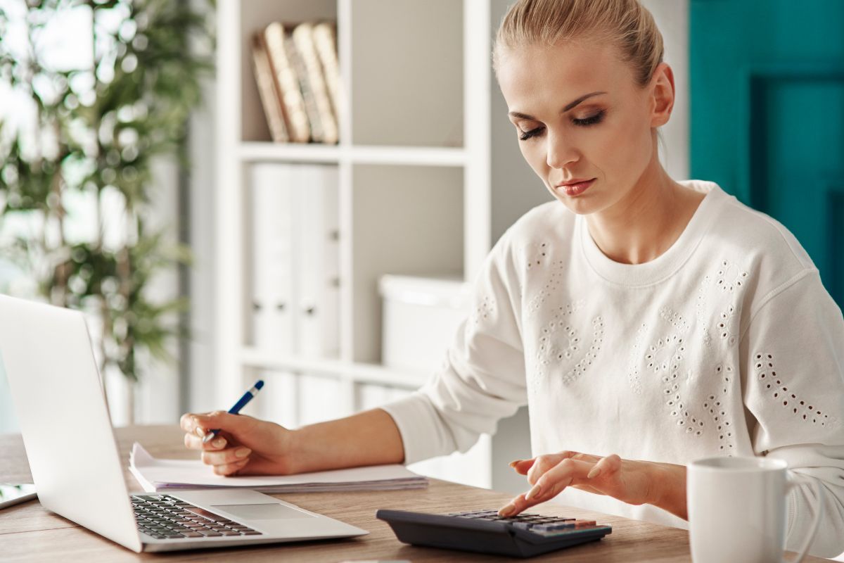 The picture of a woman budgeting.