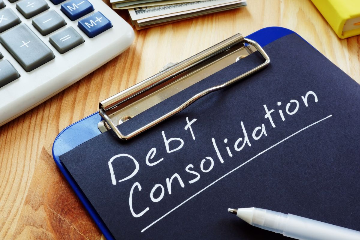 The picture shows a black paper with debt consolidation wording.