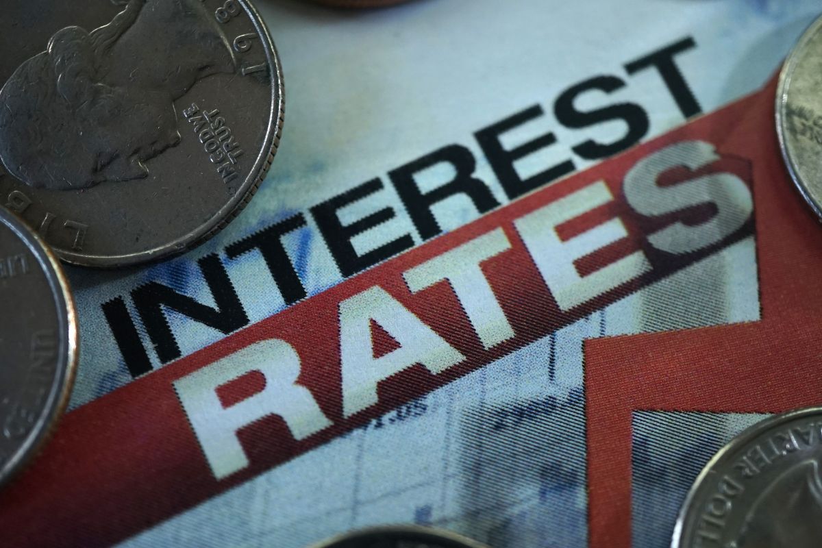 Photo of money and interest rates wording.