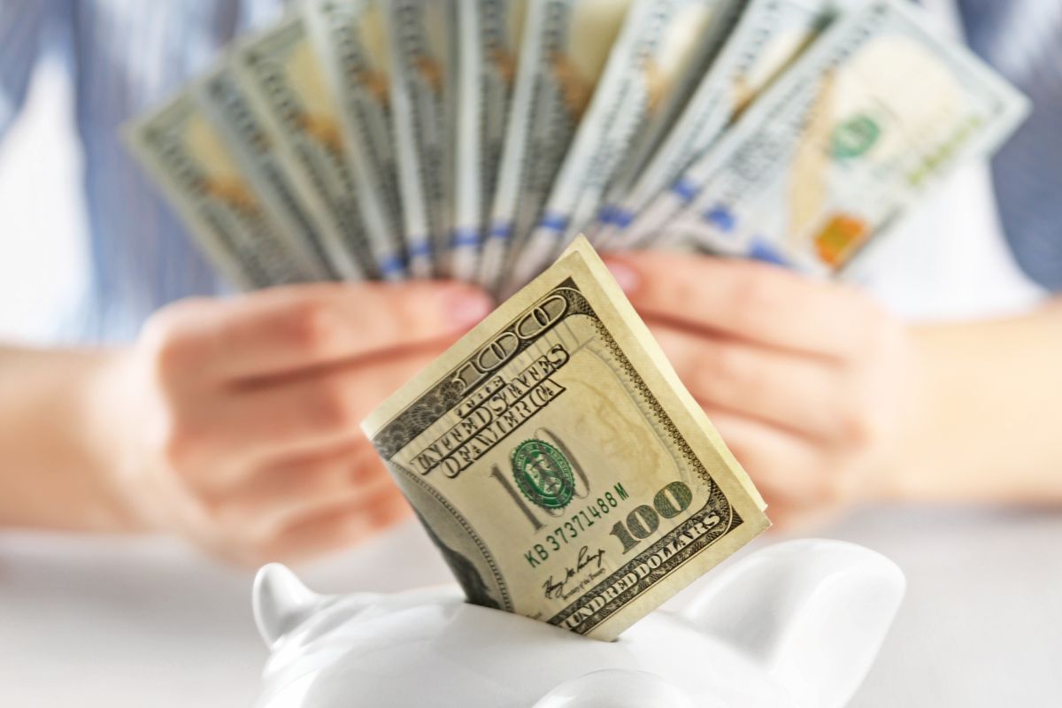 The photo of a woman saving money.